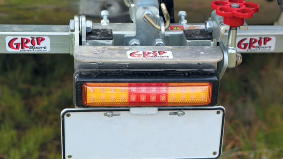 The optional LED number plate mount is a handy addition. Loosening the red knob on the right allows the rack to tilt.